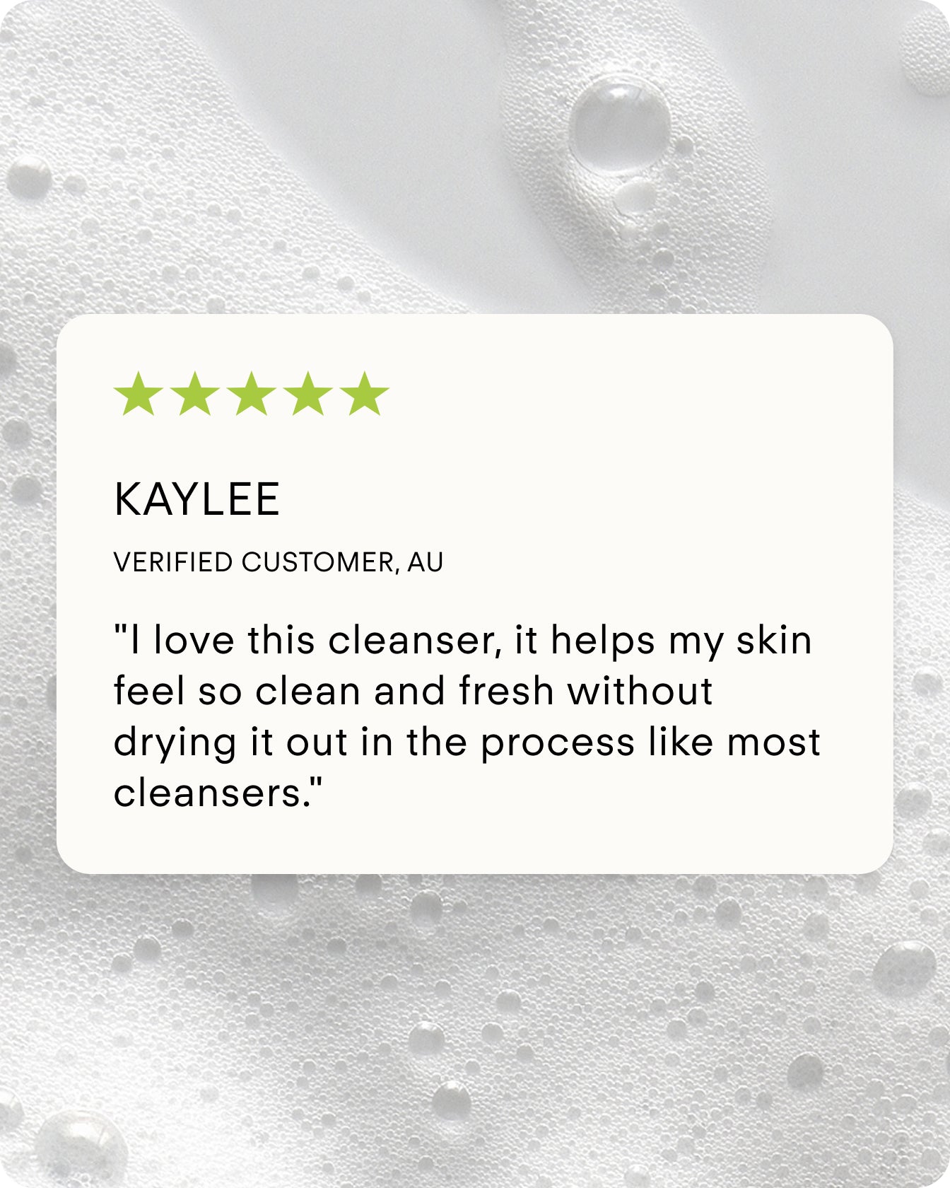 A five-star review says: I love B² Hydrating Balancing Gel Facial Cleanser—it leaves my skin clean and fresh without drying it out, unlike most cleansers. Background features white foamy bubbles.