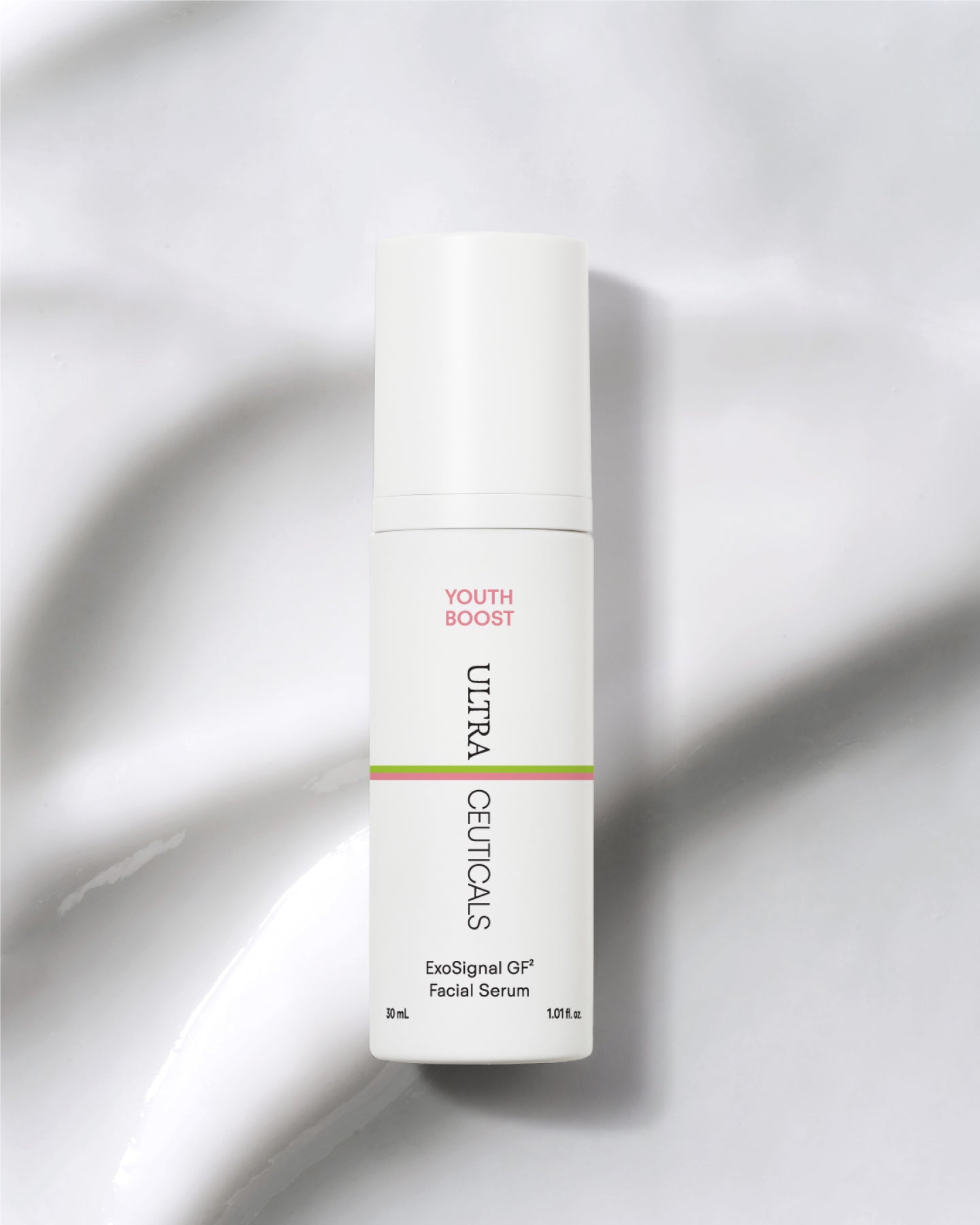 A white bottle of Youth Boost ExoSignal GF² Facial Serum stands upright on a light, textured surface with soft shadows in the background.