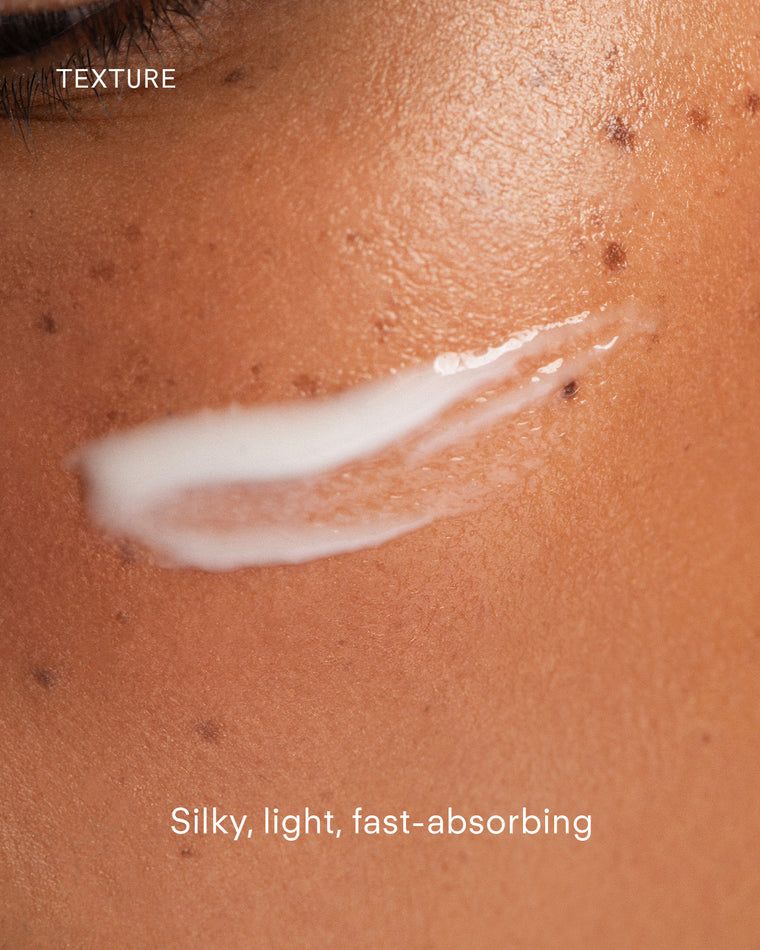 A close-up of a cheek with a swipe of white cream, highlighting skin texture. Text reads: TEXTURE and Ultra A Perfecting Serum—silky, light, fast-absorbing; perfect for your anti-aging ritual.
