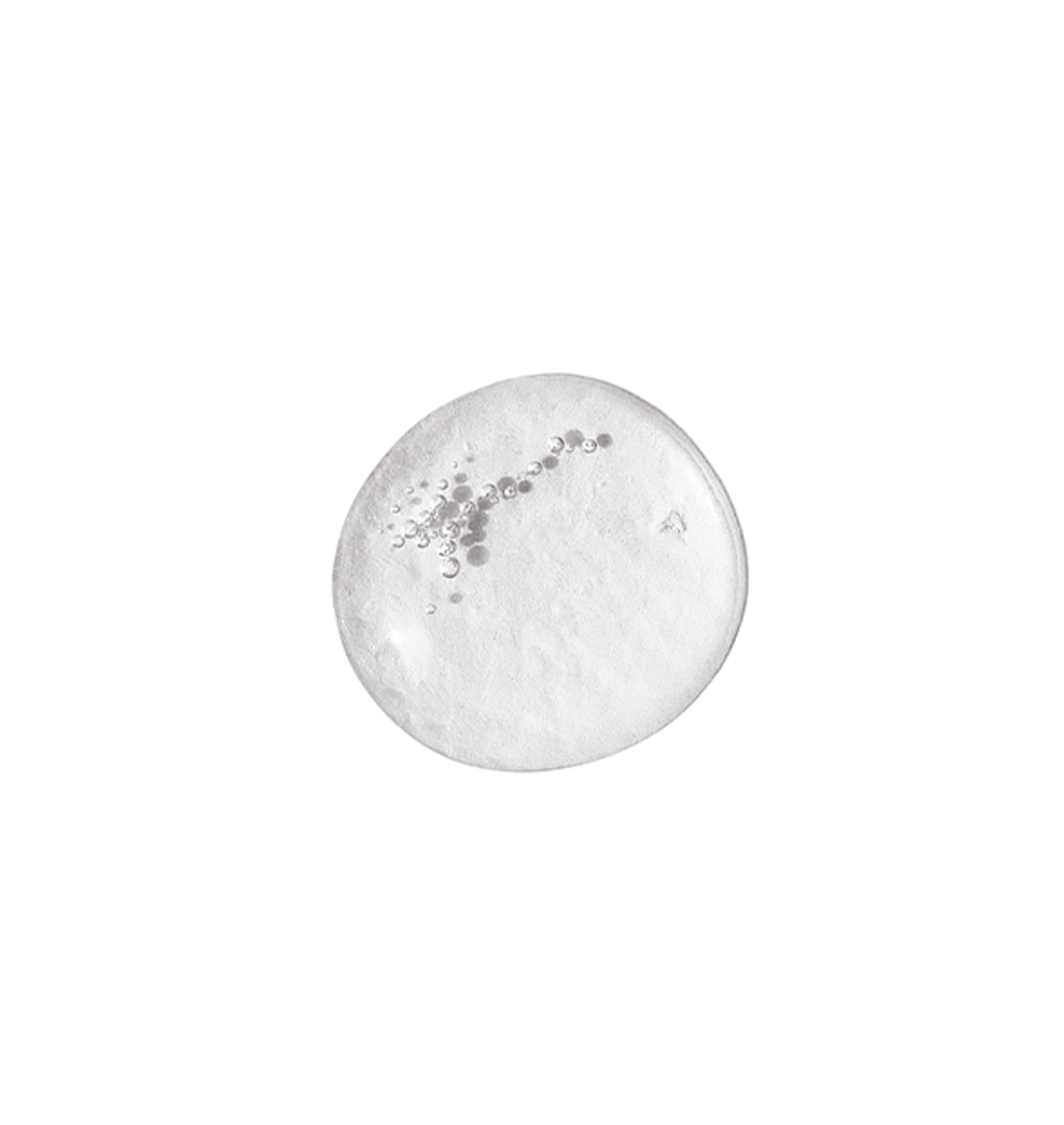 A clear, round droplet of Even Skintone Smoothing Serum Concentrate with suspended bubbles, set against a plain white background—an ideal gentle liquid exfoliator for addressing uneven skin tone.