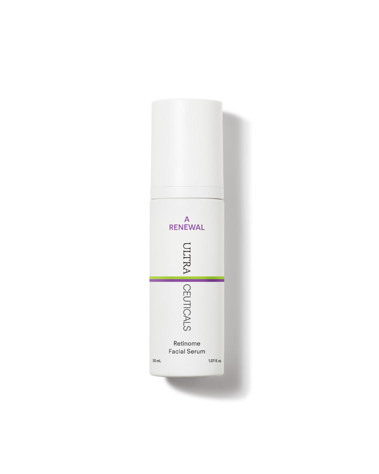 A white bottle of A Renewal Retinome Facial Serum with purple and green stripes stands upright on a white background, casting a faint shadow.