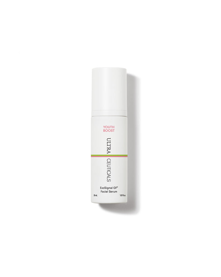 A white bottle of Youth Boost ExoSignal GF² Facial Serum—featuring plant-derived exosomes and "YOUTH BOOST" in pink near the top—stands upright on a white background with a soft shadow.