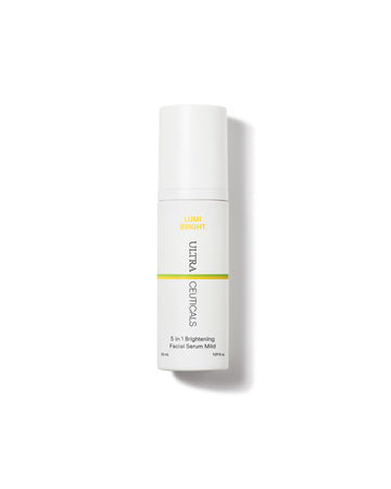 A white bottle of Ultra Brightening Serum Mild, containing niacinamide and mandelic acid for advanced skin brightening, stands upright on a plain white background with a soft shadow.