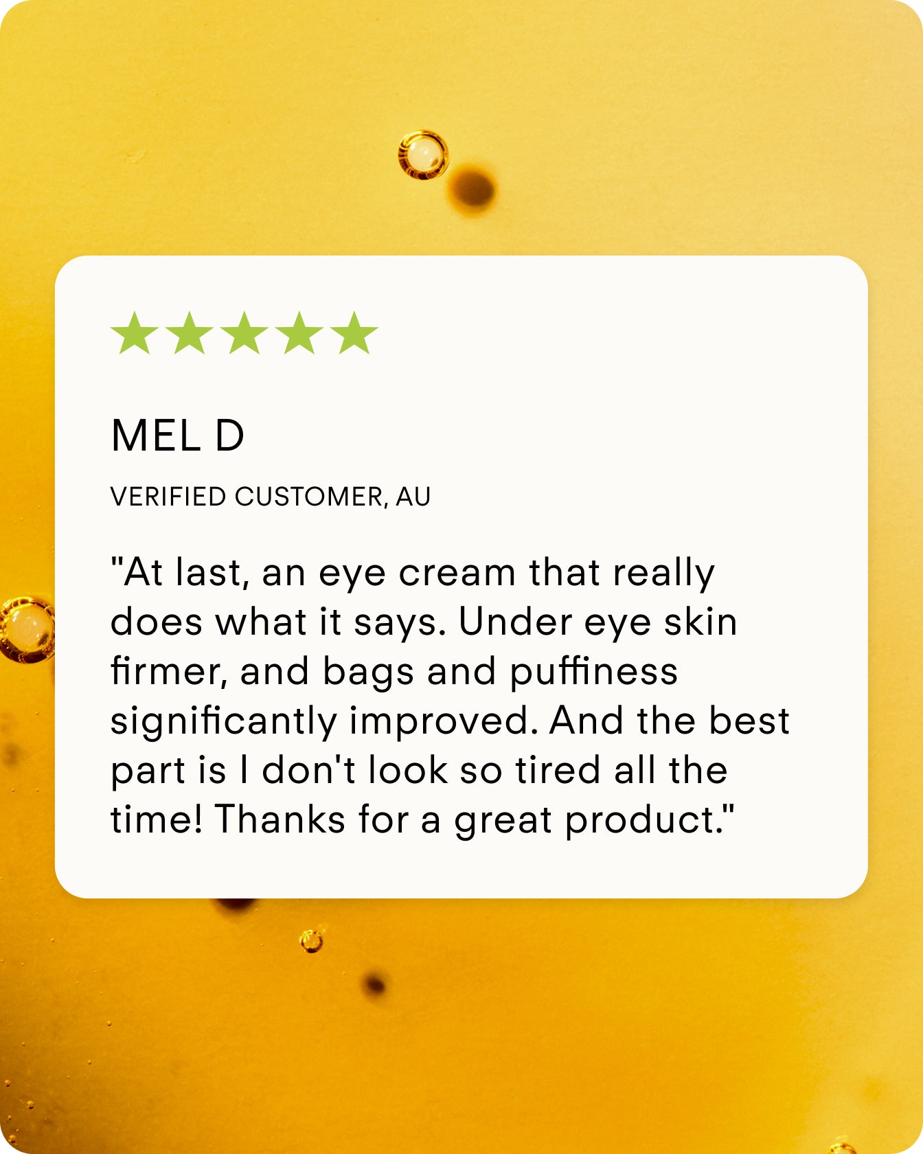 A review card on a yellow background features small bubbles, a 5-star rating, and praise for Ultra C Firming Concentrate for reducing eye bags, puffiness, and brightening skin to help users look less tired.