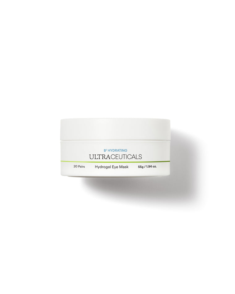 A white container of Ultra B² Hydrating Eye Mask, 55g (1.94 oz), with green and blue text is displayed on a plain white background; this eye mask is enriched with hyaluronic acid to help target fine lines.