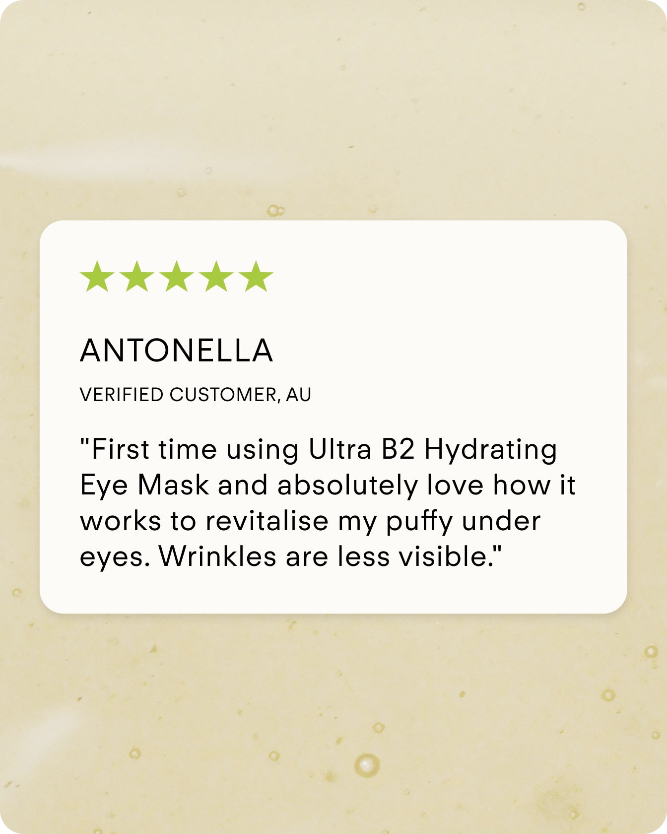 Antonella gave the Ultra B² Hydrating Eye Mask a 5-star review, praising its hyaluronic acid formula for revitalizing puffy under eyes and reducing fine lines and wrinkles. Seen on a white card against a beige background.