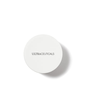 A round, white container labeled ULTRACEUTICALS in bold black letters rests on a plain white background with a subtle shadow—ideal for storing your Ultra Rich Moisturiser Cream.