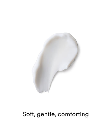 A small dollop of Ultra Calming Moisturiser Cream is spread smoothly on a white background. Below, "Soft, gentle, comforting" is written in black text—perfect for sensitive skin.