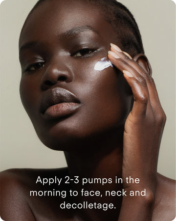A woman with dark skin applies C+ Rejuvenating Pro-Collagen Night Cream to her cheek. Text reads: Apply nightly to face, neck, and decolletage to help brighten skin and improve texture.