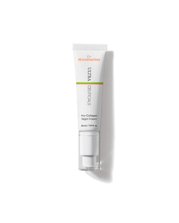 A white tube of C+ Rejuvenating Pro-Collagen Night Cream with a pump and orange-gold accents is centered on a white background. This 30 ml cream works overnight to refine texture for a smoother, more radiant complexion.