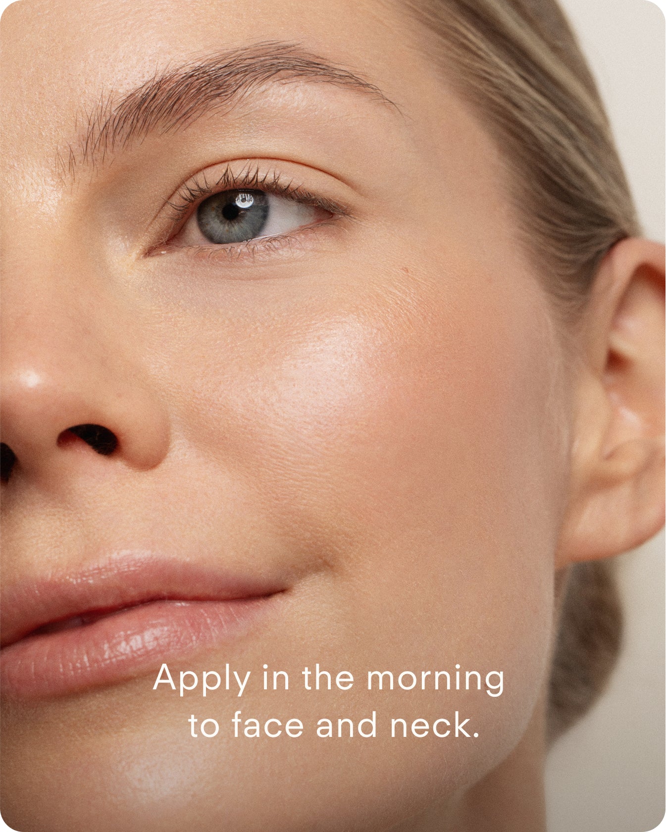 Close-up of a woman’s glowing, smooth skin with minimal makeup. Text: Apply Ultra Protective Antioxidant Complex to face and neck each morning for stronger skin resilience against environmental stressors.