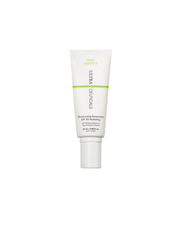 A white tube of Daily Defence Moisturising Sunscreen SPF 50 Hydrating Mini with green and black text and a white flip-top cap stands upright against a plain white background.