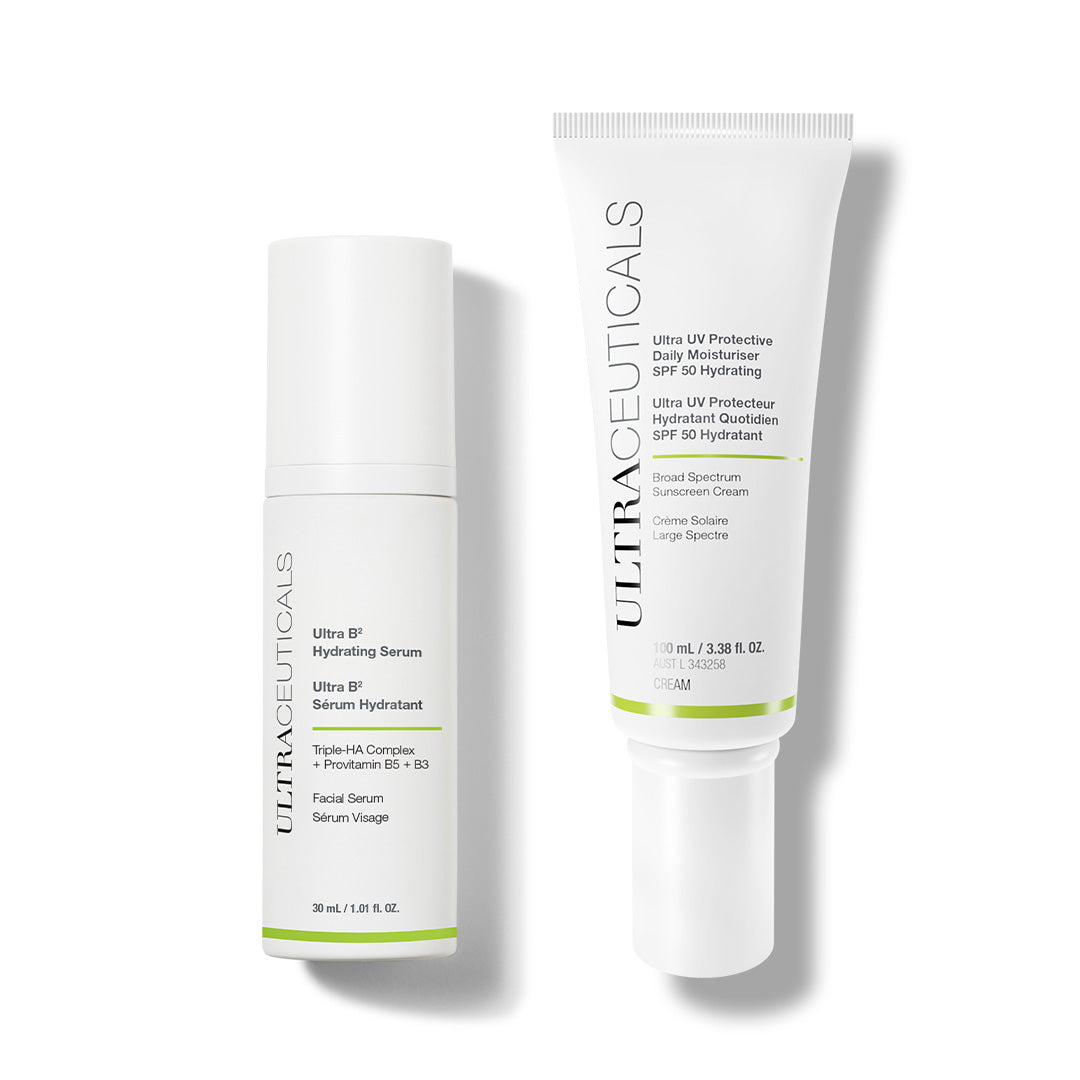 The Ultra B² Hydrate & Protect Set features two white Ultraceuticals skincare bottles—a hydrating serum and the Ultra UV Protective Daily Moisturizer SPF 30—standing upright on a white background to boost your skin barrier and hydration.